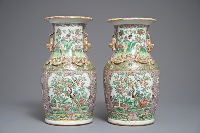 A pair of Chinese pink ground Canton vases, 19th C.