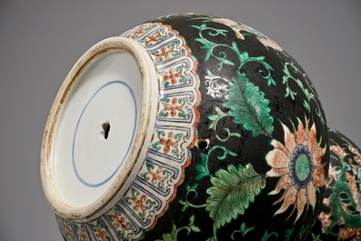 A Chinese black-ground famille verte double gourd dragon vase, 19th C.