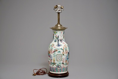 A Chinese famille rose vase with applied design mounted as a lamp, 19th C.