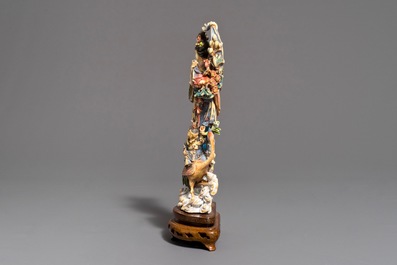 A Chinese polychrome carved ivory figure of Magu on wooden base, 1st half 20th C.