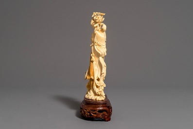 A Chinese carved ivory figure of Chang'e on wooden base, 1st half 20th C.