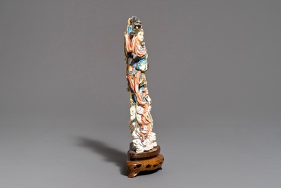 A Chinese polychrome carved ivory figure of Magu on wooden base, 1st half 20th C.