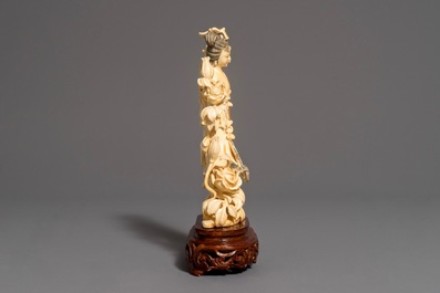 A Chinese carved ivory figure of Chang'e on wooden base, 1st half 20th C.