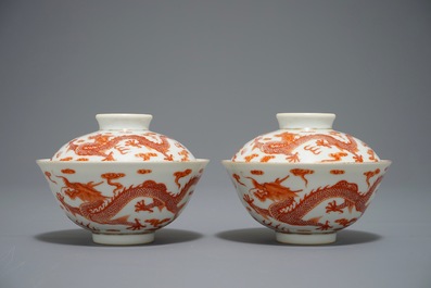 A pair of Chinese iron red dragon bowls and covers, Xianfeng mark, 19/20th C.