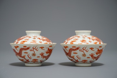A pair of Chinese iron red dragon bowls and covers, Xianfeng mark, 19/20th C.
