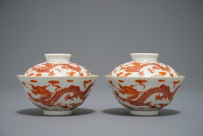 A pair of Chinese iron red dragon bowls and covers, Xianfeng mark, 19/20th C.