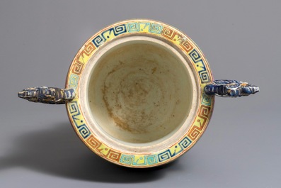 A large Chinese famille rose lime-green-ground incense burner with dragons, 19th C.