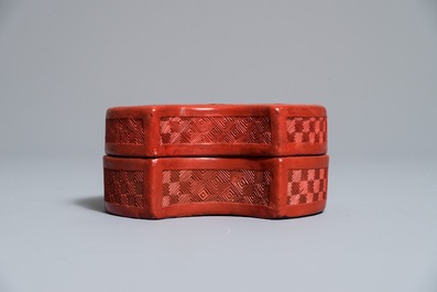 A Chinese cinnabar lacquer ingot-shaped box and cover, 18/19th C.