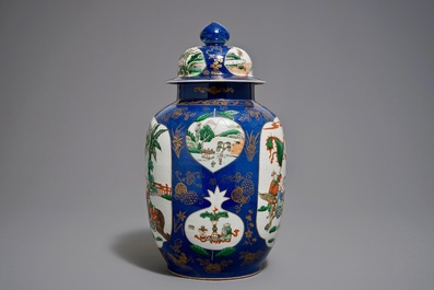 A Chinese famille verte on powder blue ground vase and cover, 19th C.