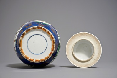 A Chinese famille verte on powder blue ground vase and cover, 19th C.
