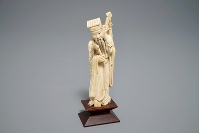 Two Chinese carved ivory figures of Shou Lao and Lu Dongbin, 19th C.