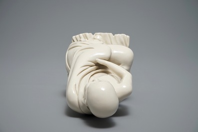 A Chinese Dehua blanc de Chine figure of a Luohan, 19th C.