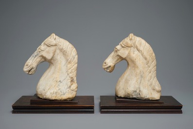 A pair of Chinese carved marble horse heads, poss. Tang
