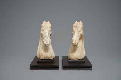 A pair of Chinese carved marble horse heads, poss. Tang