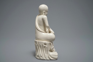 A Chinese Dehua blanc de Chine figure of a Luohan, 19th C.