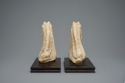 A pair of Chinese carved marble horse heads, poss. Tang