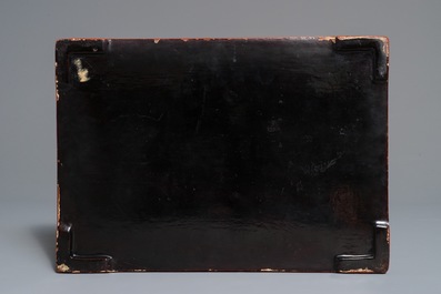 A rectangular Chinese cinnabar lacquer three-tier box and cover with figures in a garden, 19th C.