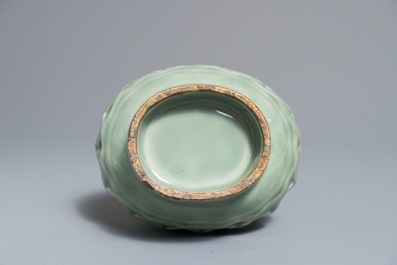 A Chinese celadon-glazed reticulated double-walled vase, 19/20th C.