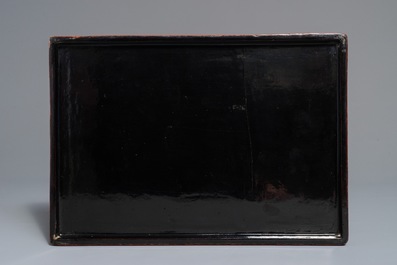 A rectangular Chinese cinnabar lacquer three-tier box and cover with figures in a garden, 19th C.