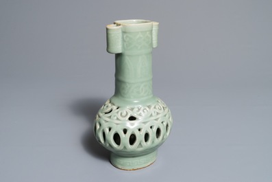 A Chinese celadon-glazed reticulated double-walled vase, 19/20th C.