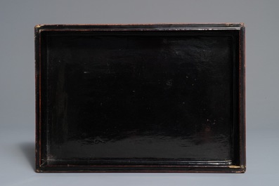 A rectangular Chinese cinnabar lacquer three-tier box and cover with figures in a garden, 19th C.