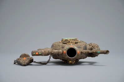 A silvered and parcel-gilt brass jug inlaid with turquoise and coral, Tibet or Mongolia, 19th C.