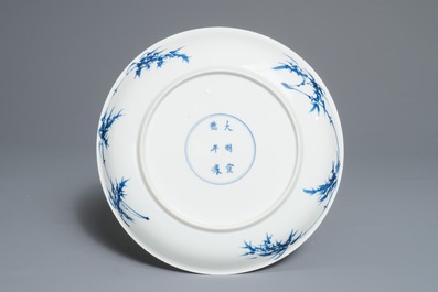 A Chinese blue, white and underglaze red dish, Xuande mark, Kangxi