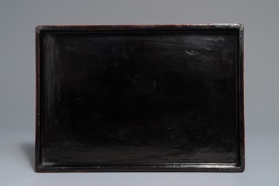 A rectangular Chinese cinnabar lacquer three-tier box and cover with figures in a garden, 19th C.