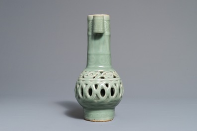 A Chinese celadon-glazed reticulated double-walled vase, 19/20th C.