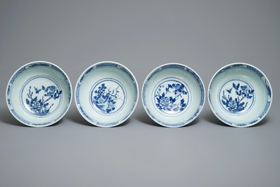Four Chinese blue and white bowls with birds, butterflies and flowers, 19th C.