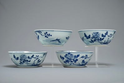 Four Chinese blue and white bowls with birds, butterflies and flowers, 19th C.