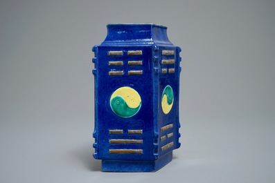A Chinese blue-ground lozenge-shaped cong vase with taoist symbols, 19th C.