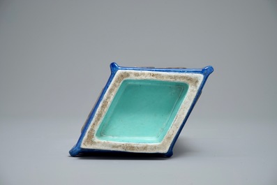 A Chinese blue-ground lozenge-shaped cong vase with taoist symbols, 19th C.