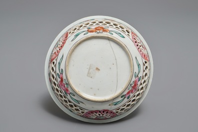 A reticulated double-walled Chinese famille rose cup and saucer, Yongzheng