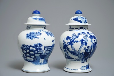 Two Chinese blue and white vases and covers with figures, 19th C.