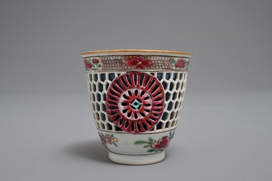 A reticulated double-walled Chinese famille rose cup and saucer, Yongzheng