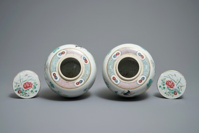 A pair of Chinese famille rose jars and covers with insects and flowers, Qianlong mark, 19/20th C.