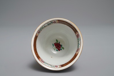 A reticulated double-walled Chinese famille rose cup and saucer, Yongzheng