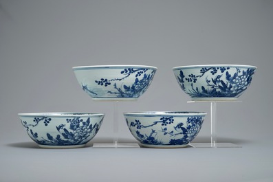 Four Chinese blue and white bowls with birds, butterflies and flowers, 19th C.