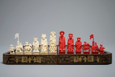 A Chinese lacquered chess and backgammon board with ivory chessmen, 19th C.