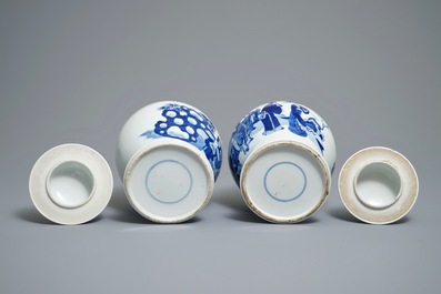 Two Chinese blue and white vases and covers with figures, 19th C.