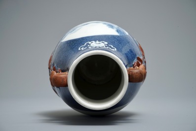 A Chinese blue and white powder blue-ground hu vase with landscape medallions, 19/20th C.