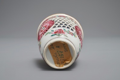 A reticulated double-walled Chinese famille rose cup and saucer, Yongzheng