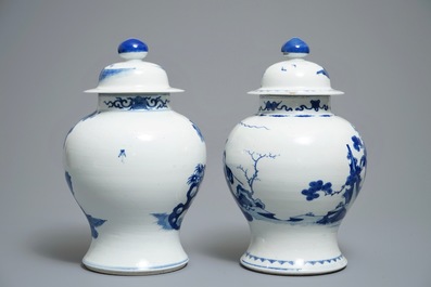 Two Chinese blue and white vases and covers with figures, 19th C.