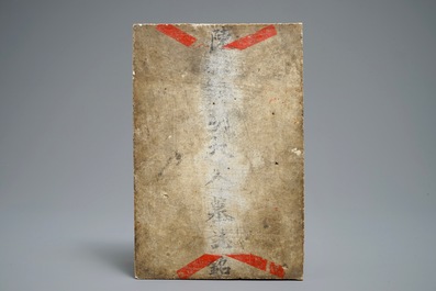 A Chinese blue and white tile plaque with engraved text, 19th C.