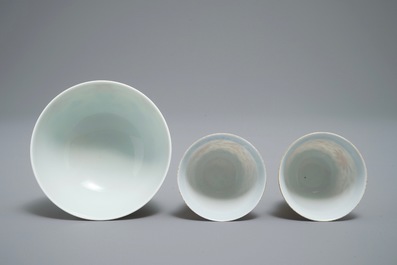 A pair of Chinese iron red and blue cups and a bowl, Qianlong and Guangxu marks, 19/20th C.