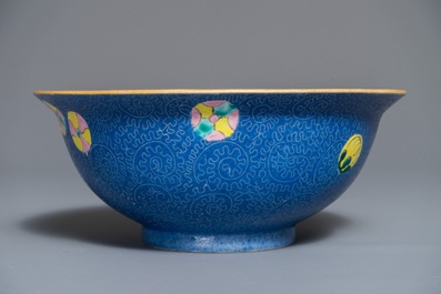 A Chinese famille rose blue ground sgraffiato bowl, Qianlong mark, 19th C.