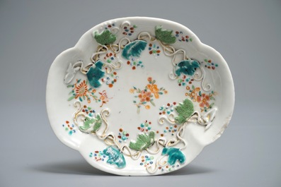 Two Chinese famille rose tea caddies and a relief-decorated cup and saucer, Yongzheng/Qianlong
