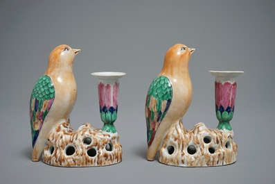 A pair of Chinese famille rose candle holders shaped as birds on a rock, Jiaqing