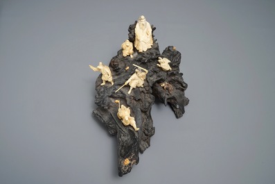 A Japanese carved ivory group on rootwood base, prob. Tokyo school, Meiji, 19th C.